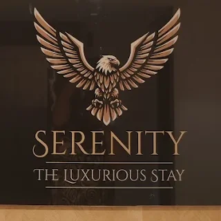 Serenity The Luxurious Stay signage emblem